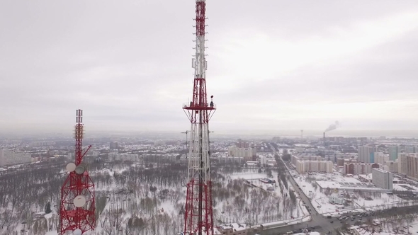 Drone Is Moving To a Site of Telecom Tower When Workers Are Performing Repair