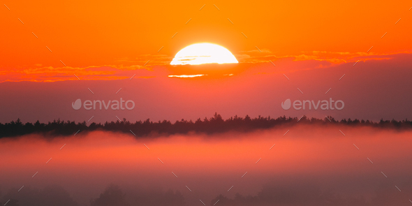 Amazing Sunrise Over Misty Landscape. Scenic View Of Foggy Morni - Stock Photo - Images