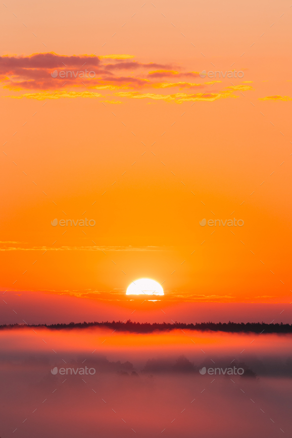 Amazing Sunrise Over Misty Landscape. Scenic View Of Foggy Morni - Stock Photo - Images