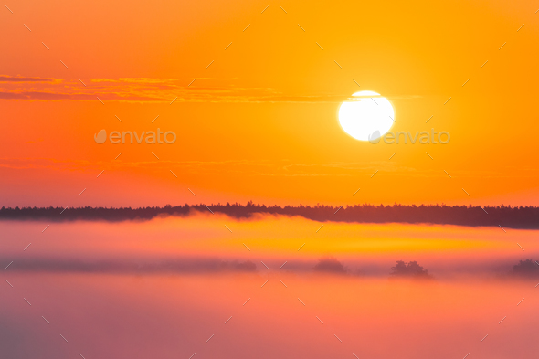 Amazing Sunrise Over Misty Landscape. Scenic View Of Foggy Morni - Stock Photo - Images