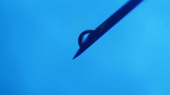 Blobs of Water Grow on a Tip of a Slanting Needle and Come Down in a Lab