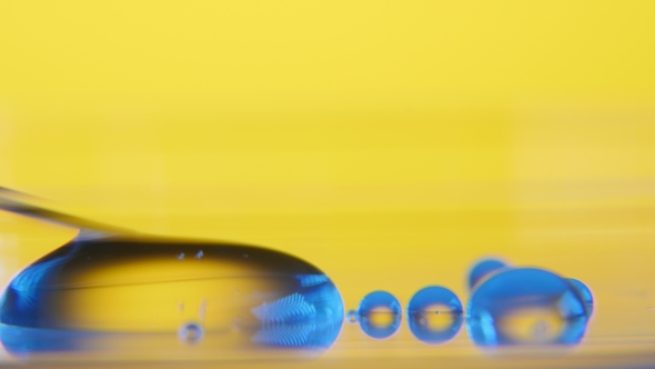 Slanting Needle Absorbs Water From a Small Puddle on a Glassy Surface in a Lab