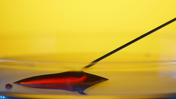 Thin Needle Takes in Red Blood From a Glassy Area in a Medical Laboratory