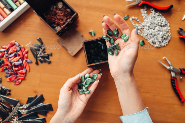 Female hands holds needlework accessories top view - Stock Photo - Images