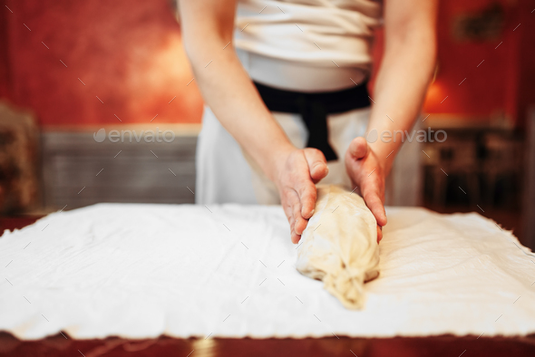 Chef prepares classic apple strudel for baking - Stock Photo - Images