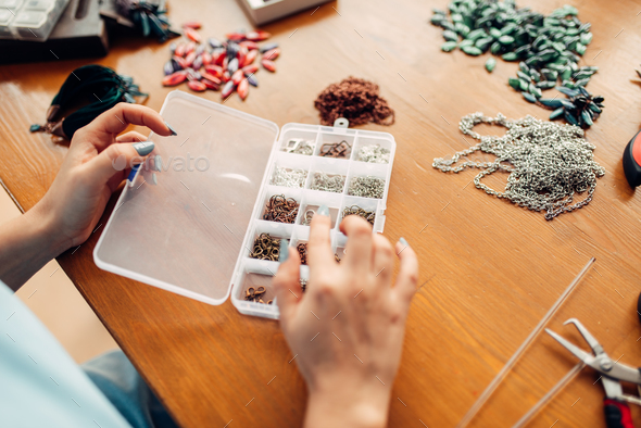 Female hands against accessories for needlework - Stock Photo - Images