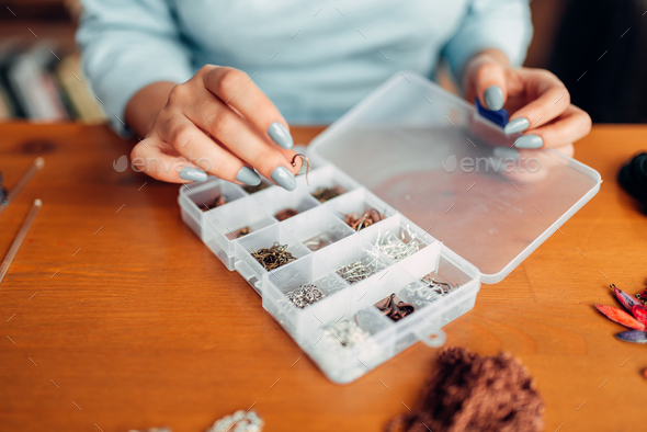Female hands against accessories for needlework - Stock Photo - Images