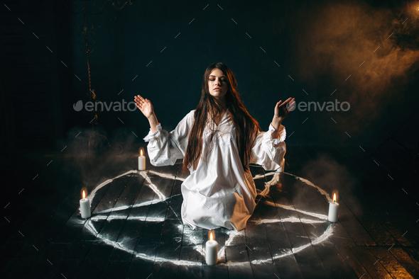 Witch in pentagram circle, evocation of spirits - Stock Photo - Images