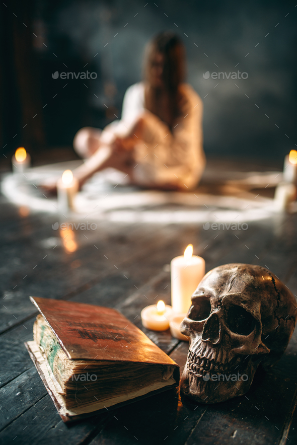 Human skull and spellbook, occultism and exorcism - Stock Photo - Images