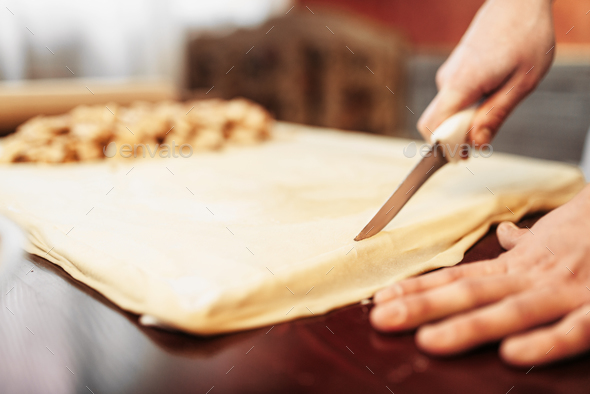 Male chef prepares apple strudel - Stock Photo - Images