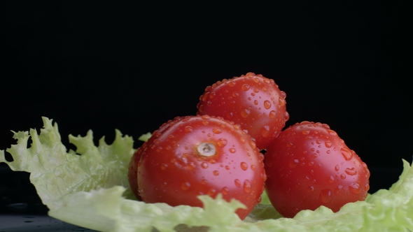 Tomato From a Large Set of Vegetables on a Black Background. Concept of Vegetarianism and Healthy alt