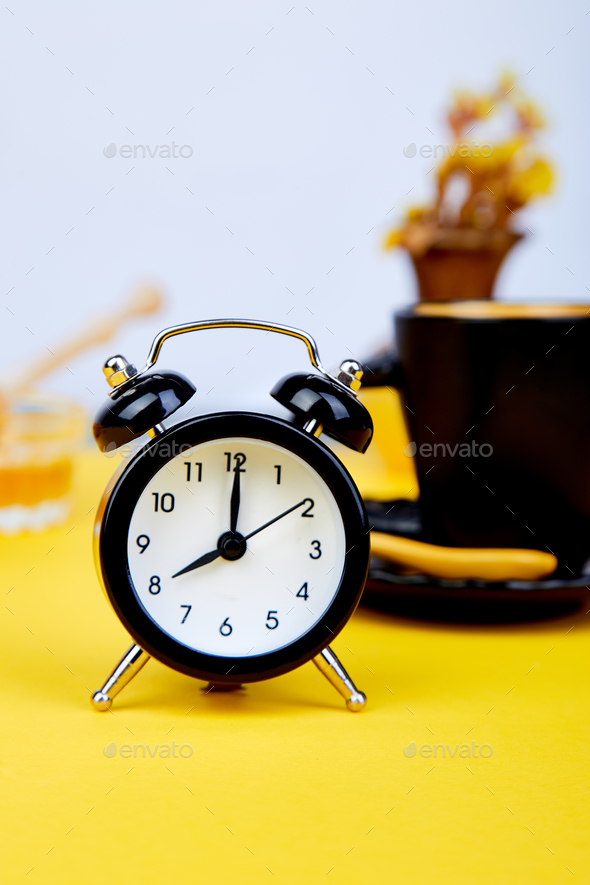 Morning coffee, granola breakfast, alarm clock - Stock Photo - Images