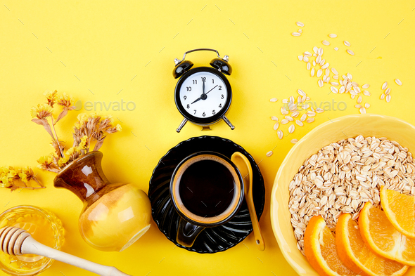 Morning coffee, granola breakfast, alarm clock - Stock Photo - Images