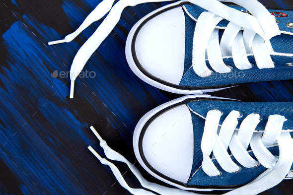 Flat lay of female or male sneakers shoes - Stock Photo - Images
