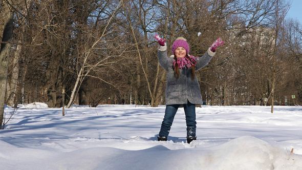 Little Girl Having Fun in Winter City Park