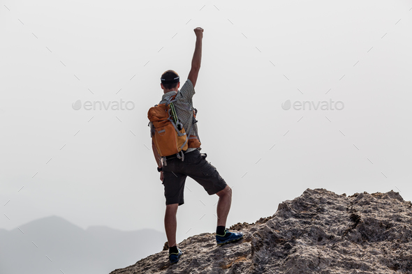 Happy winner reaching life goal success man - Stock Photo - Images