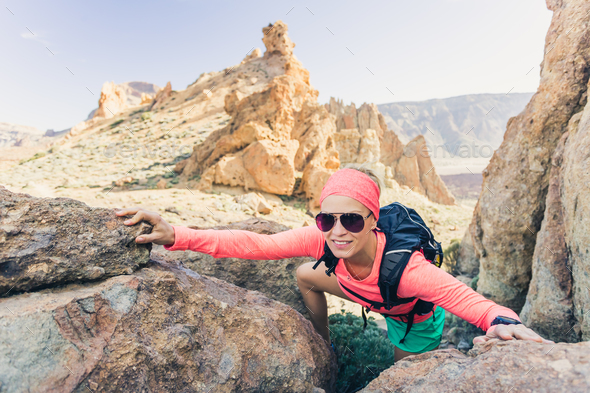 Woman hiker reached mountain top, backpacker adventure Stock Photo by blas
