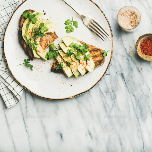 Avocado toast with seasoning and lemon water, square crop - Stock Photo - Images