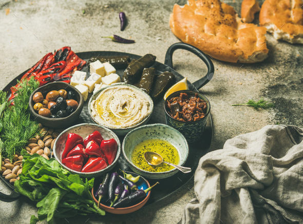 Mediterranean meze starter fingerfood platter in tray, selective focus - Stock Photo - Images