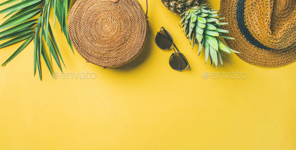 Colorful summer female fashion outfit over yellow background, wide composition - Stock Photo - Images