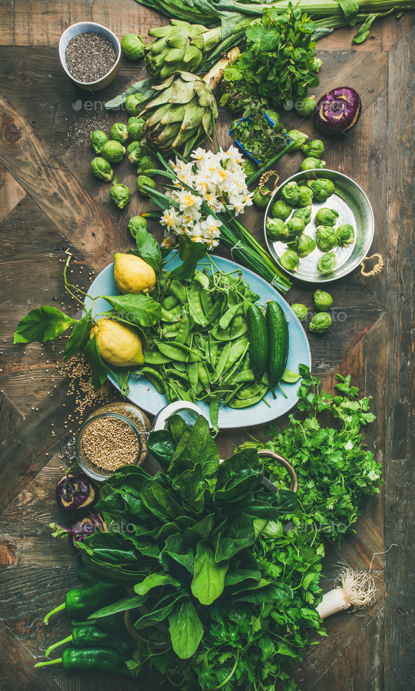 Spring healthy vegan food cooking ingredients, wooden background, vertical composition - Stock Photo - Images