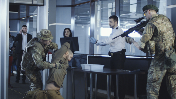 Man Transitting Weapon Standing in Airport alt