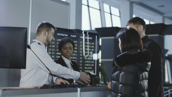 Airport Workers Checking Documents at Control Point alt