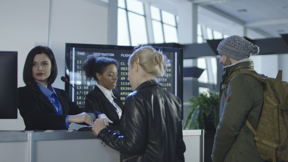 Airport Security Personnel Processing Passengers alt