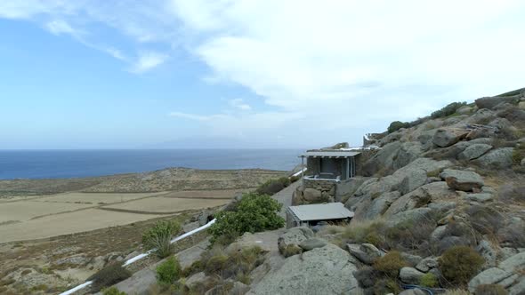 Aerial view above of rock mountain formation on the coast, Greece. alt