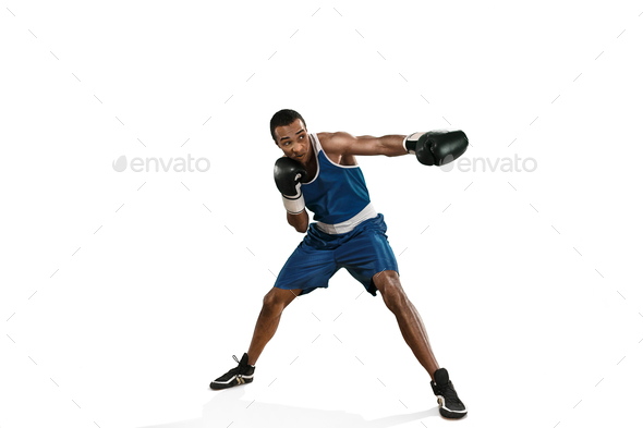 Sporty man during boxing exercise making hit. Photo of boxer on white background - Stock Photo - Images