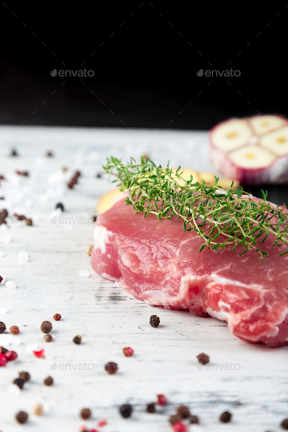 Raw pork meat with spice ingredient - Stock Photo - Images