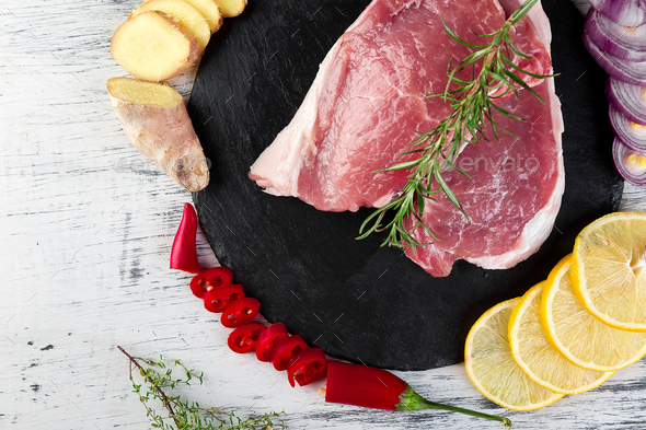Raw pork meat with spice ingredient - Stock Photo - Images