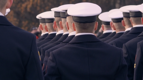Soldiers in Blue Uniform and White Beautiful Caps alt