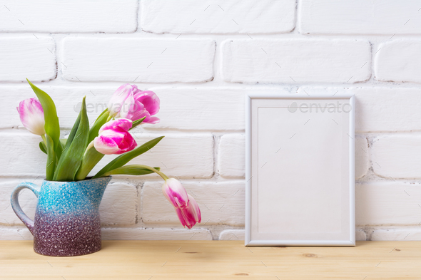 White small frame mockup with pink tulip in purple blue vase - Stock Photo - Images
