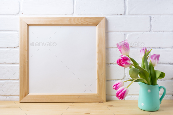 Wooden square frame mockup with pink tulip in mint pitcher vase - Stock Photo - Images