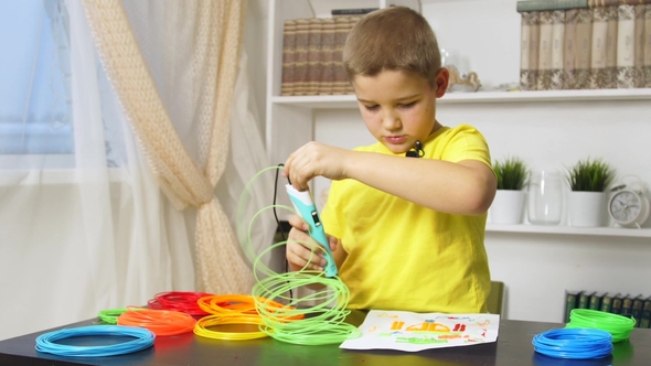 Boy Drawing with 3D Pen alt