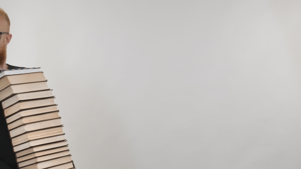 A Well-read Red-haired Guy Carries a Lot of Books alt