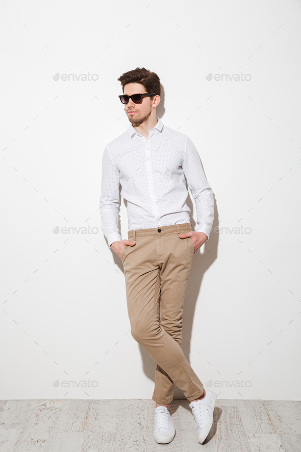 Full length picture of modern calm guy dressed in casual clothin - Stock Photo - Images