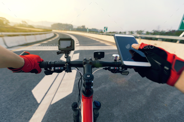 Use mobile phone while riding bike on highway Stock Photo by lzf ...