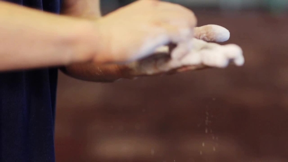 Man Applying Talcum Powder To His Hands 19 alt