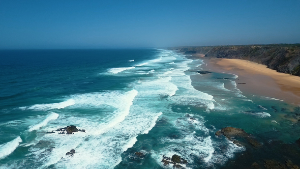 Aerial Footage of Ocean Waves Reaching Shore at West Coast Portugal alt