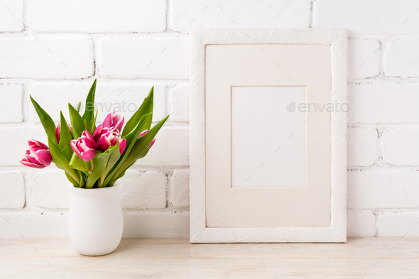 White frame mockup with magenta pink tulip in the flower pot - Stock Photo - Images
