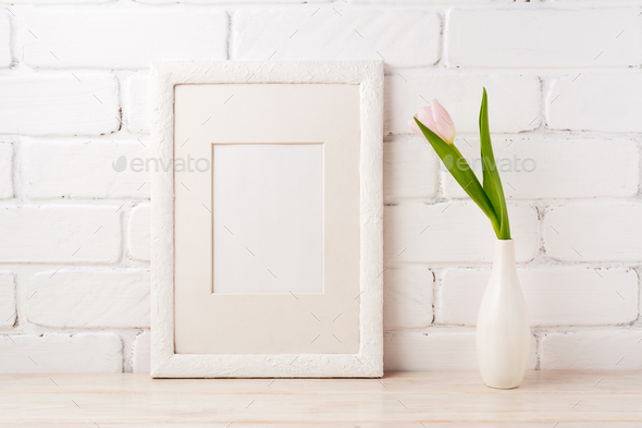 White frame mockup with tender pink tulip - Stock Photo - Images