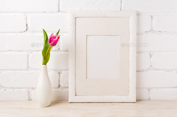 White frame mockup with magenta pink tulips - Stock Photo - Images