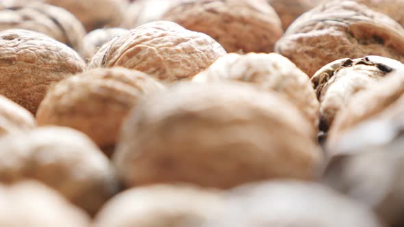 Wallnuts in the shell arranged  natural organic food 4K 2160p 30fps UltraHD footage - Juglans regia 