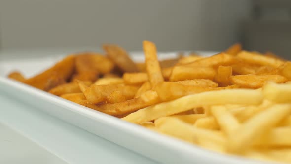 Freshly Prepared French Fries in a Package Ready for Consumption alt