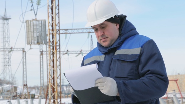 Engineer With Tablet at Electric Power Station