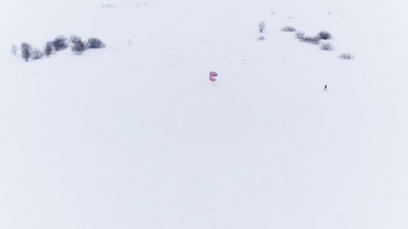 Aerial View of People Engaged in Extreme Sports in Winter