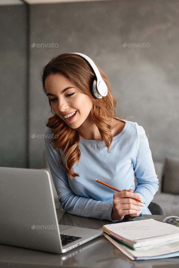 Portrait of an excited young woman - Stock Photo - Images