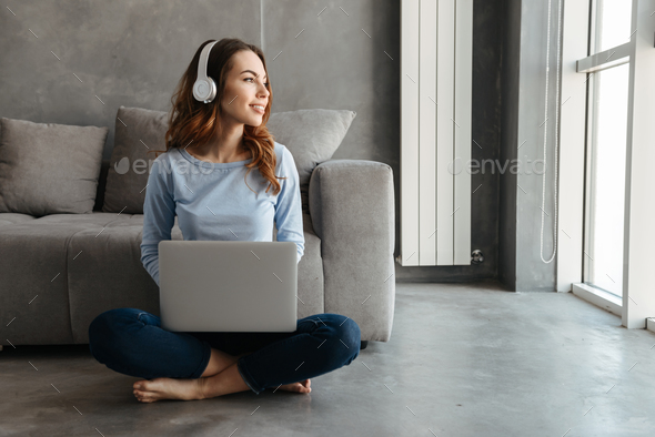 Portrait of a smiling young woman - Stock Photo - Images